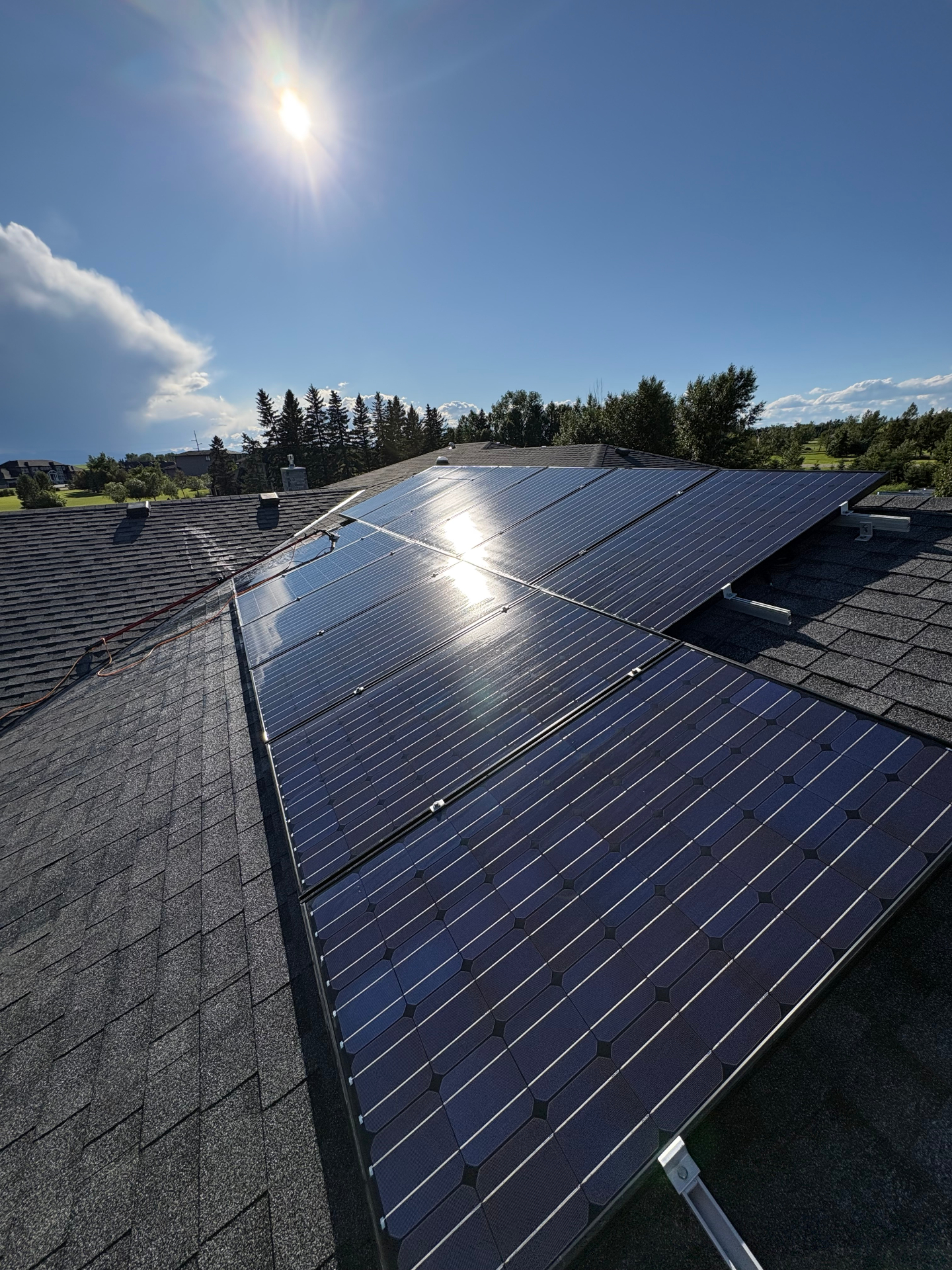 Freshly cleaned solar panels on a Calgary roof